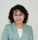 Zdjęcie przedstawia uśmiechniętą kobietę w okularach, jest to Prezydent Rehabilitation International Zhang Haidi.